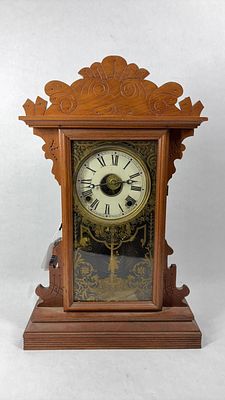 Key WInd Oak Gingerbread Mantle Clock. Clock will need some repair to hands, includes pendulum 