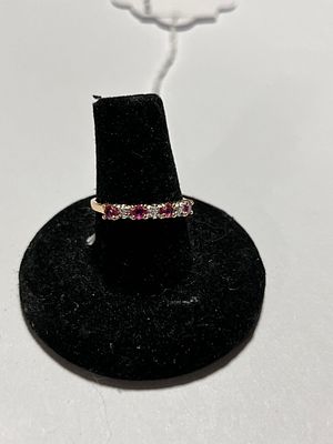 10K Gold & Ruby Half Eternity Ring. Alternated rubies and diamond set in a yellow gold band. 