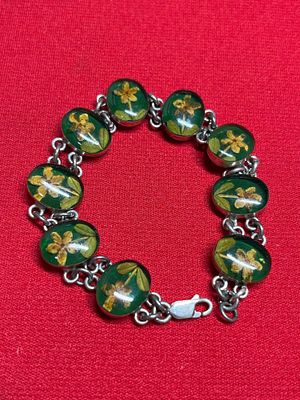 Daffodil Resin Sterling Panel Bracelet. 9 floral panels each ajoned with sterling chain. 7 inches .