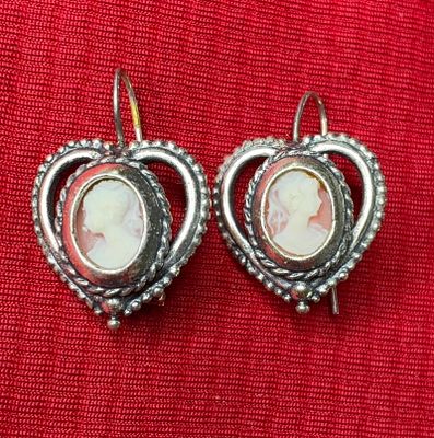 Carved Cameo Sterling Earrings. Heart shaped sterling frames with a twisted rope design, encases 