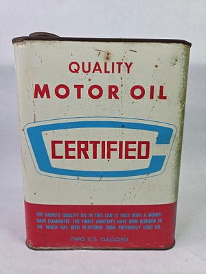 Certified Oil Company 2 Gal. Motor Oil Can. Showing discoloration as well as cap is missing with 