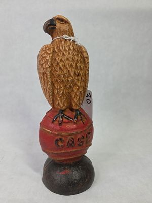 J.I. Case Old Abe Cast Iron Eagle Figural Coin Bank. Showing paint loss as well as rusting due 