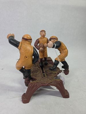 Cast Iron Painted Calamity / Football Mechanical Coin Bank. Good overall condition standing 6.5 in. H