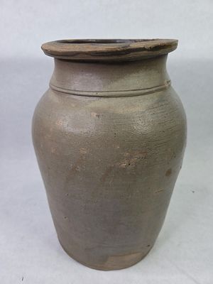 2 Gal. Stoneware Crock. Showing hairlines and crazing due to age and usage with discoloration