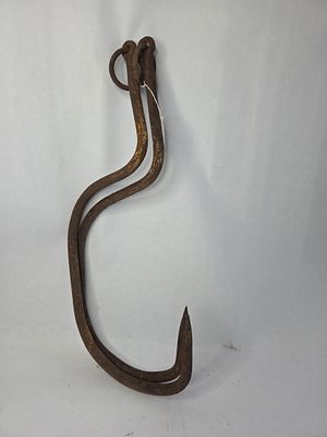 2 large primitive cast iron meat hooks. Show some rust and pitting 26 in long