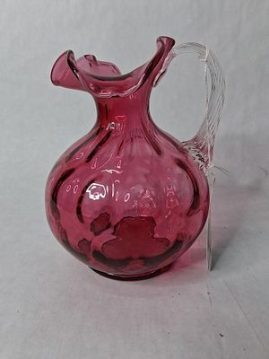 Fenton cranberry dot optic 20 oz pitcher. in excellent condition no chips or cracks 7 in tall.