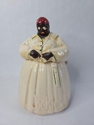 McCoy black americana mammy cookie jar. Paint loss and crackling do to age and usage no major 
