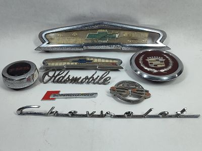 Vintage Automobile Emblems Inc Cadillac, Impala, Chevy, Super Charged, Oldsmobile and More. This 