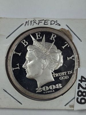 2008 NORFED Liberty Dollar ($50) One Ounce Silver Round Tenth Anniversary Edition. Showing minor 