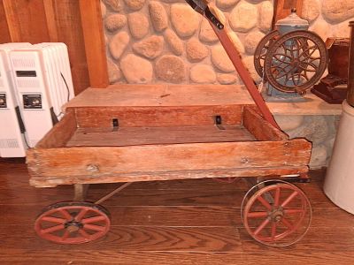 Antique Wood and Iron Child's Express Pull Wagon. 10 in diameter x 22 inches tall. This is an 