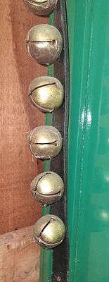 Antique Brass Crotal Sleigh Bells on Leather Strap. A collection of brass crotal bells mounted 