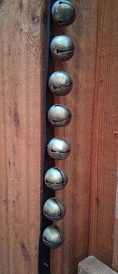 Set Antique Graduated Brass Petal Sleigh Bells. This lot consists of a set of graduated 