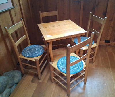 A Set of Early American Style Oak Dining Furniture. This group of furniture includes a compact 