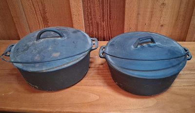 Pair Vtg Cast Iron Dutch Ovens w/ Griswold No. 6. A pair of vintage cast iron Dutch ovens. The 