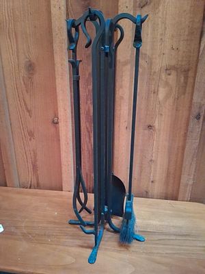 5-Piece Set Wrought Iron Fireplace Tools & Stand. This five-piece fireplace accessory set is 