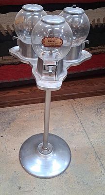 Northwestern Triple Head Bulk Vending Machine. A trio of bulk vending machine heads mounted on a 
