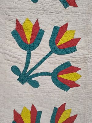 Mid-20th C. American Appliqued Cotton Tulip Quilt. 64 x 78 A hand-crafted cotton bed quilt 