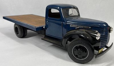 Attributed 1941 GMC Flatbed, Highway 61. 16 in. This scale model of a 1941 GMC flatbed truck is 