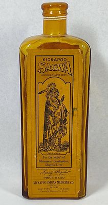 Kickapoo Sagwa Amber Bottle w/ Labels. 8.5 in. This antique amber glass bottle was produced by 