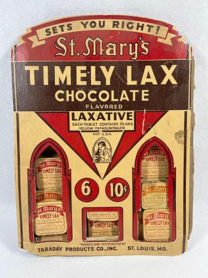 St. Mary's Timely-Lax Display & Tins. This lot features a mid-20th-century point-of-sale 