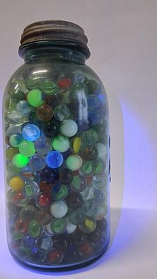 UV Glass Marbles in Ball Mason Jar. 2 qt blue jar This lot features a large collection of 
