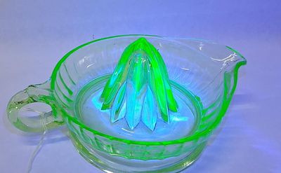 Uranium Green Ribbed Glass Reamer. 8 in wide This is a vintage one-piece citrus juicer reamer 