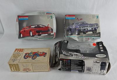 Monogram, Pyro & Testors Auto Kits. An assortment of four vintage automotive model kits from 