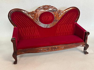 Rococo Revival Style Red Velvet Settee. A miniature settee constructed from dark-stained wood 