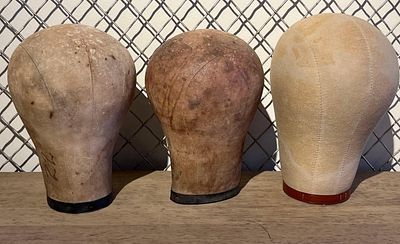 Three Canvas Millinery & Wig Blocks. This lot features three professional-grade head forms 