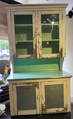 Distressed Wood & Metal Kitchen Hutch. A two-piece kitchen hutch of wooden construction 