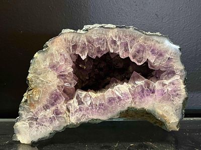 Amethyst Geode Section w/ Polished Face. This natural amethyst geode section features a central 
