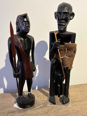 Pair African Hardwood Tribal Figures. This pair of hand-carved representational sculptures is 