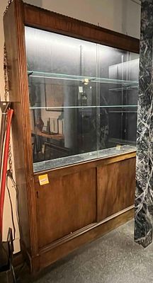 Mid-C. Lighted Display Cabinet. A large wooden display cabinet or retail store fixture 