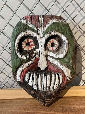 New Guinea Tiki Carved Wood Wall Mask. This hand-carved wood wall mask is crafted from a 