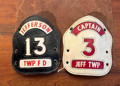Pair Jefferson Township Helmet Shields. A pair of multi-layered stitched leather fire helmet 