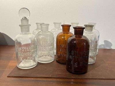Set 9 Whitall Tatum Reagent Bottles. This collection consists of nine glass laboratory reagent 