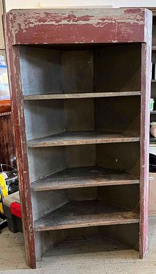 American Primitive Corner Cupboard. This nineteenth-century American primitive corner cupboard 