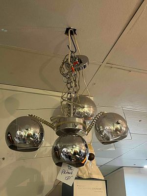 Chrome & Acrylic Eyeball Chandelier. A four-light chandelier featuring a polished chrome-plated 