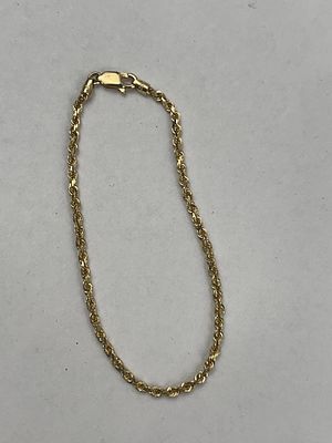14 Karat Yellow Gold Rope Bracelet. A 14 karat yellow gold bracelet in a rope chain style. The 