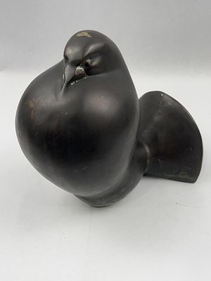 Bronze Sleeping Bird Sculpture. A modernist patinated bronze sculpture depicting a stylized 