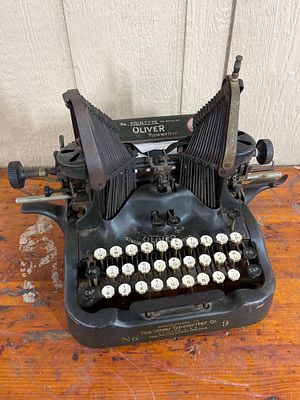 Oliver No. 9 Batwing Typewriter. An antique manual down-strike typewriter manufactured by The 