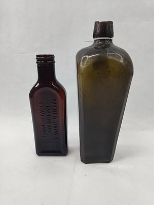 Pair Medicine & Case Gin. This lot comprises two glass bottles of differing forms and colors. 