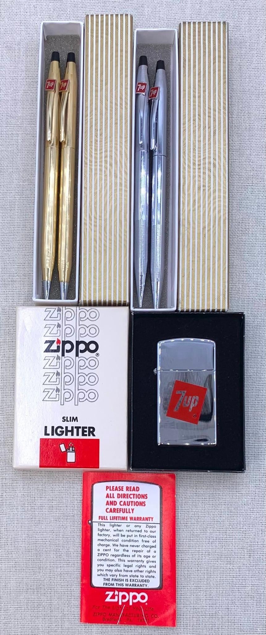 Lot 246: 5 pc Mid Century NOS ZIPPO 7up Soda Lighter and CROSS 7up Soda Writing Pens/Pencils