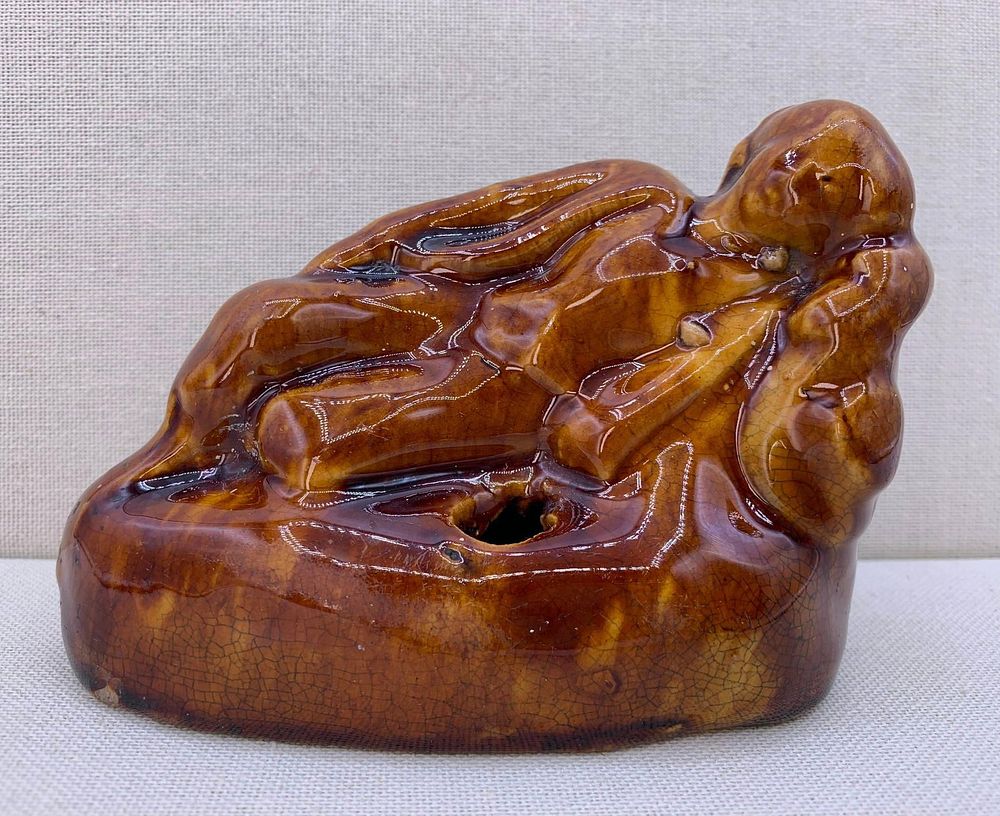 Lot 297: Antique 19th Century Yellow Ware Reclining Boy Larkin Brothers Pottery Figural Inkwell