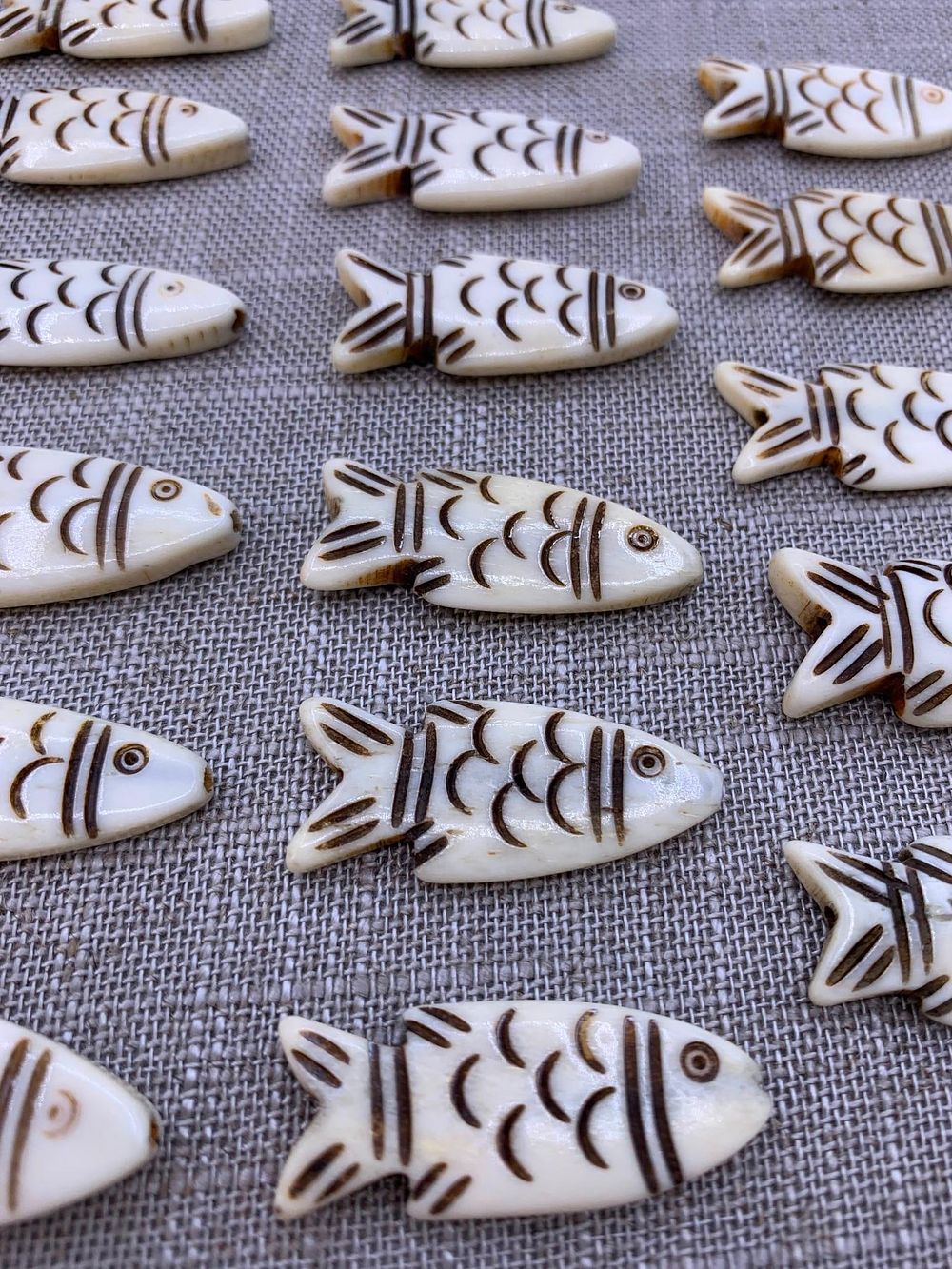 Lot 299: 34 pc Hand Carved Fish Totem Necklace Pendants, Natural Animal Effigy Charms