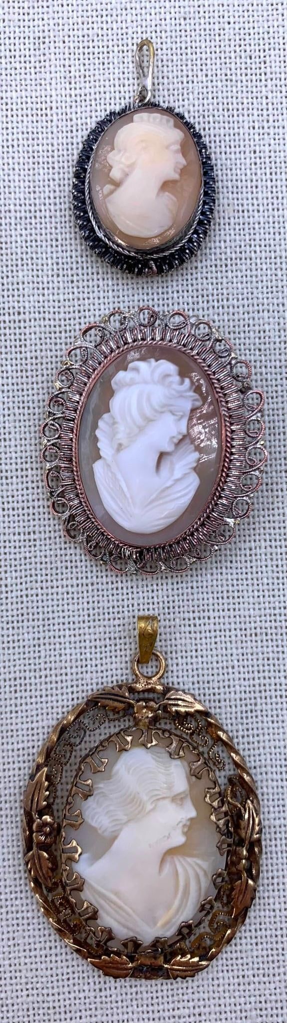 Lot 343: Trio Vintage Hand Carved Cameo Pendants, Two 800 Silver Hallmarked Frames