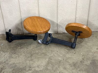 Pair Cast Iron & Oak Work Bench Stools. A pair of industrial cantilevered swing-out stools 
