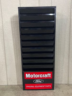 Motorcraft Ford Metal Literature Rack. 34.5 x 14 x 2 inches. A vertical, wall-mounted literature 