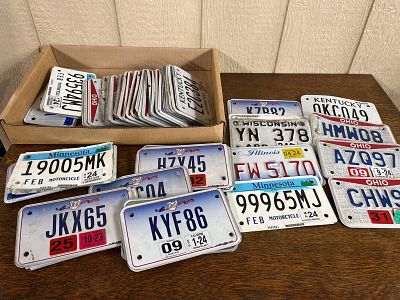 Midwest Metal Motorcycle License Plates. A collection of approximately 50 to 60 motorcycle 
