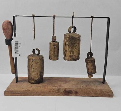 Metal Chimes on Wood Stand w/ Mallet. 10 x 12 x 5 in. A set of rustic metal bells of varying 